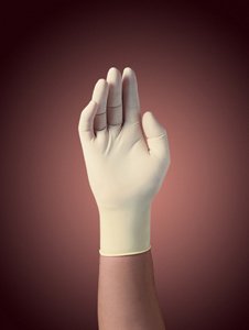 Picture of Exam Glove Kimberly-Clark® PFE™ Small NonSterile Latex Standard Cuff Length Fully Textured Natural Not Chemo Approved57220