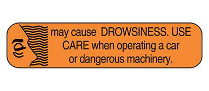Picture of Pre-Printed Label Indeed Auxiliary Label Orange Paper May Cause Drowsiness. Use Care When Operating A Car Or Dangerous Machinery Black Safety and Instructional 3/8 X 1-5/8 Inch2064
